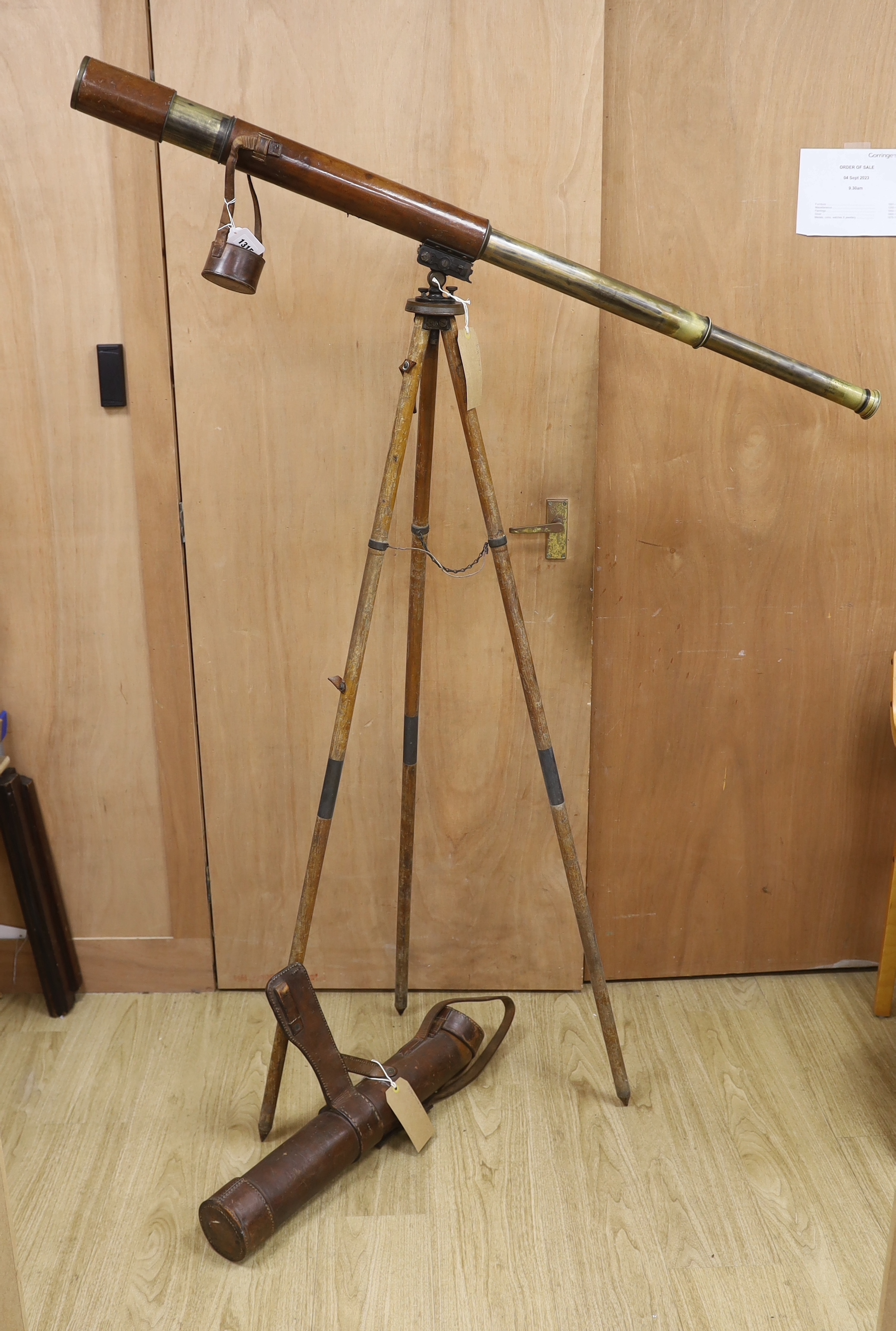 A WWI leather cased telescope and tripod, 57cm